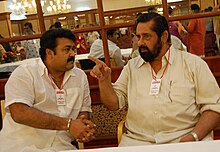 Mohanlal talking to actor Madhu