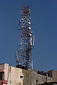 AE9. India has the world's second-largest mobile phone user base of 929.37 million users as of May 2012. Shown here is a roof top mobile phone tower in Bangalore