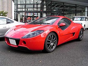 Front-three-quarter view of a two-door car with wing mirrors