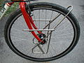 A low rider mounted on a touring bicycle for mounting panniers.