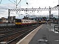 Class 314s pass at Glasgow Central