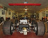 View of Lotus 49B showing high rear wing fixed directly to suspension
