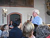 Michael Herrmann announcing a concert of Andreas Scholl and members of the Baroque orchestra Accademia Bizantina at the church of Hallgarten, 16 July 2011