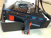 A dual-HDD rack, made as a 5.25-inch-bay device capable of simultaneously holding a 2.5-inch and a 3.5-inch SATA HDD, with two additional USB 3.0 ports