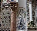 Marble column (left) embedded in the outer south wall of the mausoleum, believed to be a spolia from the Almoravid period