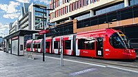 A light-rail vehicle of the Newcastle Light Rail on Honeysuckle, an urban development in Newcastle, New South Wales