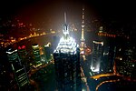 The four mechanical stories forming the spire of the building are brightly illuminated at night