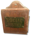 This tzedakah box hung for decades in Temple Sinai, in New Orleans, calling on congregants to support social justice causes.