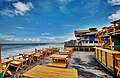 Image 65Cox's Bazar in Bangladesh known for its wide sandy beach, is believed to be the world's longest (120 km) natural sandy sea beach. It is located 152 km south of Chittagong. The photo features a beach restaurant at Cox's Bazar. Photo Credit: Xalan mustafa