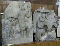 Early drum slab, with king and boy, and fragment of the relief decoration high on the dome