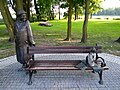 Sculpture bench in Kórnik with quotations from the poem