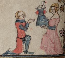 一名骑士穿着红色衣服，从一位穿着粉红色服装的少女那里接过一个带有天鹅冠的头盔，摘自英国手稿亚历山大之恋（1338-1344）。