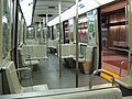 Interior of an MR-63 train showing the open two panel pocket door to the right