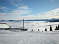 The view from Schneeberg Mountain. Clouds can be seen.