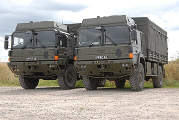 On Salisbury Plain training area, two British Army HX60 4×4 trucks in General Service configuration