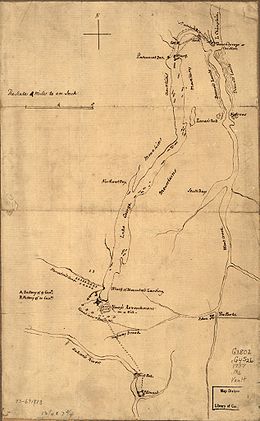 Fort Carillon, at the far northern end of the map, is separated from Lake George by a short river with falls. There is a road or path leading from the fort to the northern end of the lake with a sawmill at the first crossing. The map is labeled with mountains on both sides of Lake George, which is long and narrow and extends about three fourths of the length of the map. At its southern end, the fort is shown, with the French camp to the northwest and the camp of Indians and Canadians over the road leading south toward Fort Edward, which is near the bottom of the map on the Hudson River just below some falls.