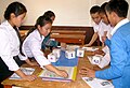 Image 24Students using dice to improve numeracy skills. They roll three dice, then use basic math operations to combine those into a new number which they cover on the board. The goal is to cover four squares in the row. (from Game)