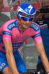 male bicyclist in colorful racing outfit