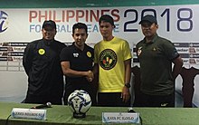 Arnie Pasinabo of Ceres-Negros (2nd from left) shakes the hand of Jalsor Soriano of Kaya FC-Iloilo in a press conference. They are flanked by the head coaches of their clubs