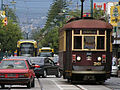 Traffic on Jetty Road, Glenelg, South Australia with a H-Class Glenelg tram and a new Bombardier Flexity Classic