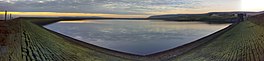 A wide angle image of a reservoir at low water