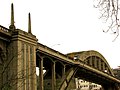 Looking up at Oregon City Bridge from Frontier Street in West Linn, in 2007, before lights were reinstalled on the obelisks