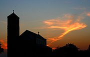 The church silhouetted against the evening sky