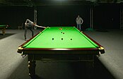 Four-time world champion Mark Selby playing at a practice table during the 2012 Masters tournament