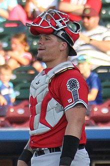 A baseball player in red