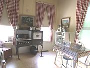 19th century kitchen of the Manistee Mansion .