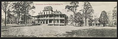 Postcard shows the school buildings and grounds of Kiskiminetas Spring School in Saltsburg, Pennsylvania.