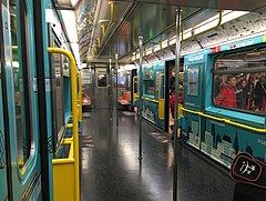 the interior of a 42nd Street Shuttle train without any seats