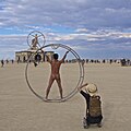 Image 25Naked participant at Burning Man 2016 posing as Leonardo da Vinci's Vitruvian Man (from Naturism)