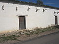 The western side of the Jesus Trevino Rancho building in the San Ygnacio Historic District; note the structural similarity to Los Corralitos Building