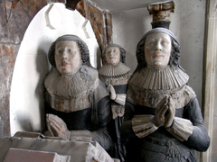 Chichester's two wives, and behind them his daughter Anne. Detail from his monument.