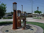 Gasoline pumps used at Morcomb's Service Station, including an 1918 visi-bowl gas pump (left) (GAHS)