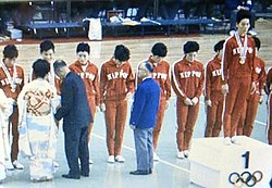 Masae Kasai standing in the center of podium as the team leader, 1964 Tokyo Olympics Women's Volleyball