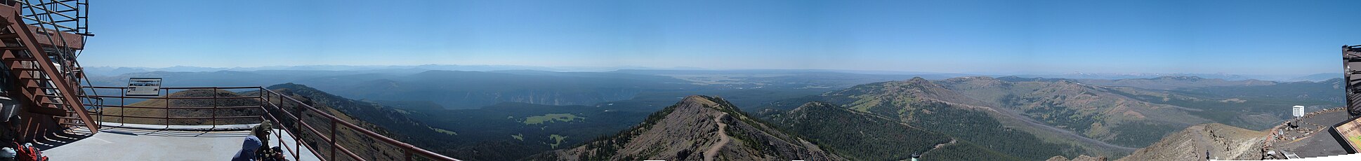 Panorama taken from the fire lookout tower on the summit of Mt. Washburn. The center of the image looks south towards the Teton Range.