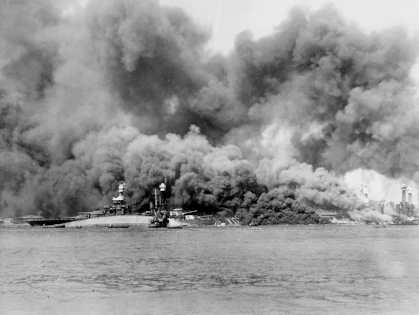USS Oklahoma, on fire, producing thick smoke, after she took heavy damage during the attack on Pearl Harbor, 1941