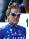 A man in sunglasses and a cycling uniform