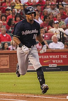 A baseball player in navy and gray