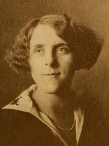 A young white woman with wavy bobbed hair, combed with a side part