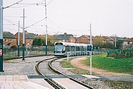 Tram to Phoenix Park nearing platform from junction