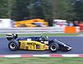 Minardi raced variations on this original black-and-gold livery in the period 1985年–1992年. This is a Minardi M185 being raced at Brands Hatch in 2005.