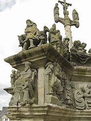 The horseman leading the cortege of Christ Carrying the Cross. In the niche below we see the seated St Matthew.