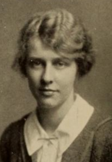 Yearbook photo of a young white woman with wavy blonde hair