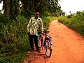 Man with a bicycle in Basankusu.