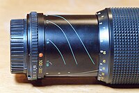 Minolta 100–300mm zoom lens with markings for reproduction ratio