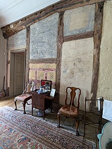 Wall panels containing Elizabethan paintings