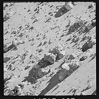 Telephoto image of rocks in the interior walls of the crater